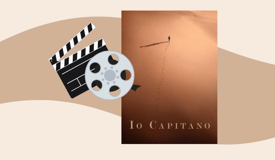 filmplakat med et menneske midt i ørkenen, sett fra luft.