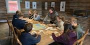 KI-generert konseptillustrasjon av det planlagte Tolkien-senteret for Norden
