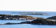merdø fotografert fra Tromøya med Torungene fyr i bakgrunnen