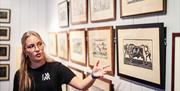 Guiden viser et bilde basert på skulpturen «To menn holder en okse" av Gustav Vigelands. (Den ene mannen står bak og holder oksen i halen. Den andre står foran og holder den i hornene.)