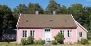Bilde av pastellrosa hus
