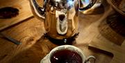 Coffe pot in Silver with a cup of coffe