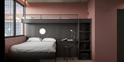 hotellrom i Hotell Arendal. enkel innredning og rosa vegger.